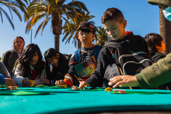 Students test origami frogs
