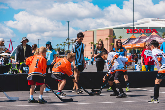 Street hockey players at face off
