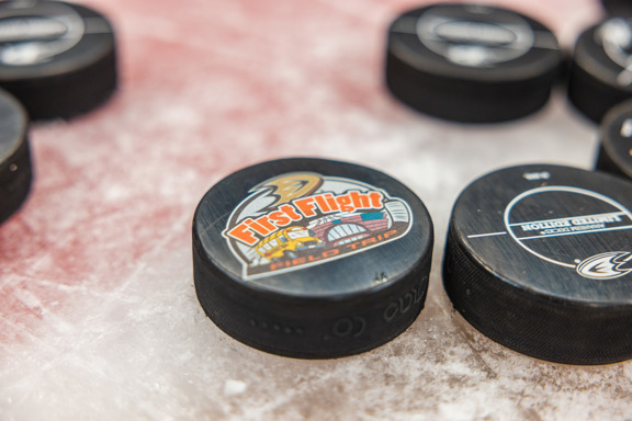 First Flight hockey puck on ice