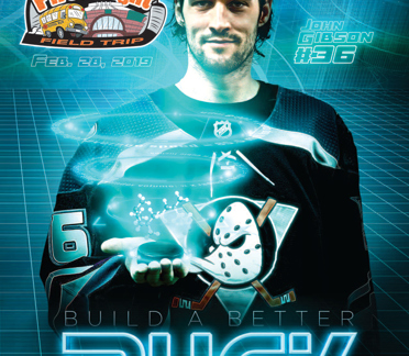First Flight  workbook cover- hockey player holding a puck