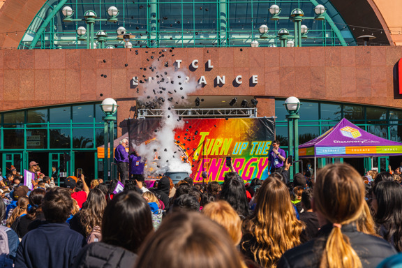 500 foam pucks launching into the air on stage surrounded by steam
