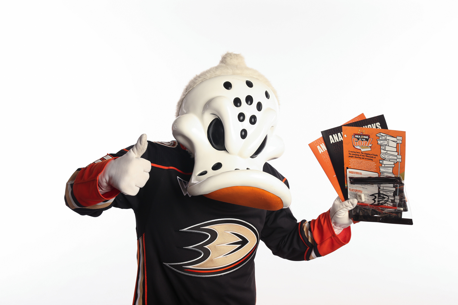 Wild Wing holding Reading is the Goal school supplies. 
